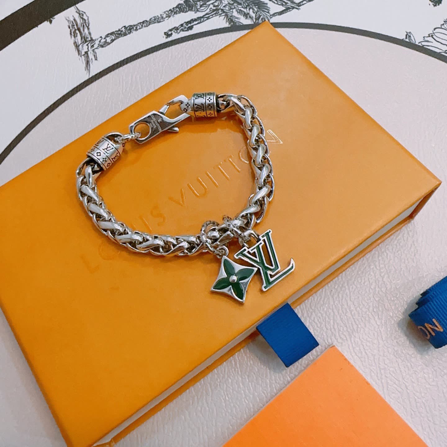 Louis Vuitton Silver Bracelet with LV Logo and Green Flower Charm
